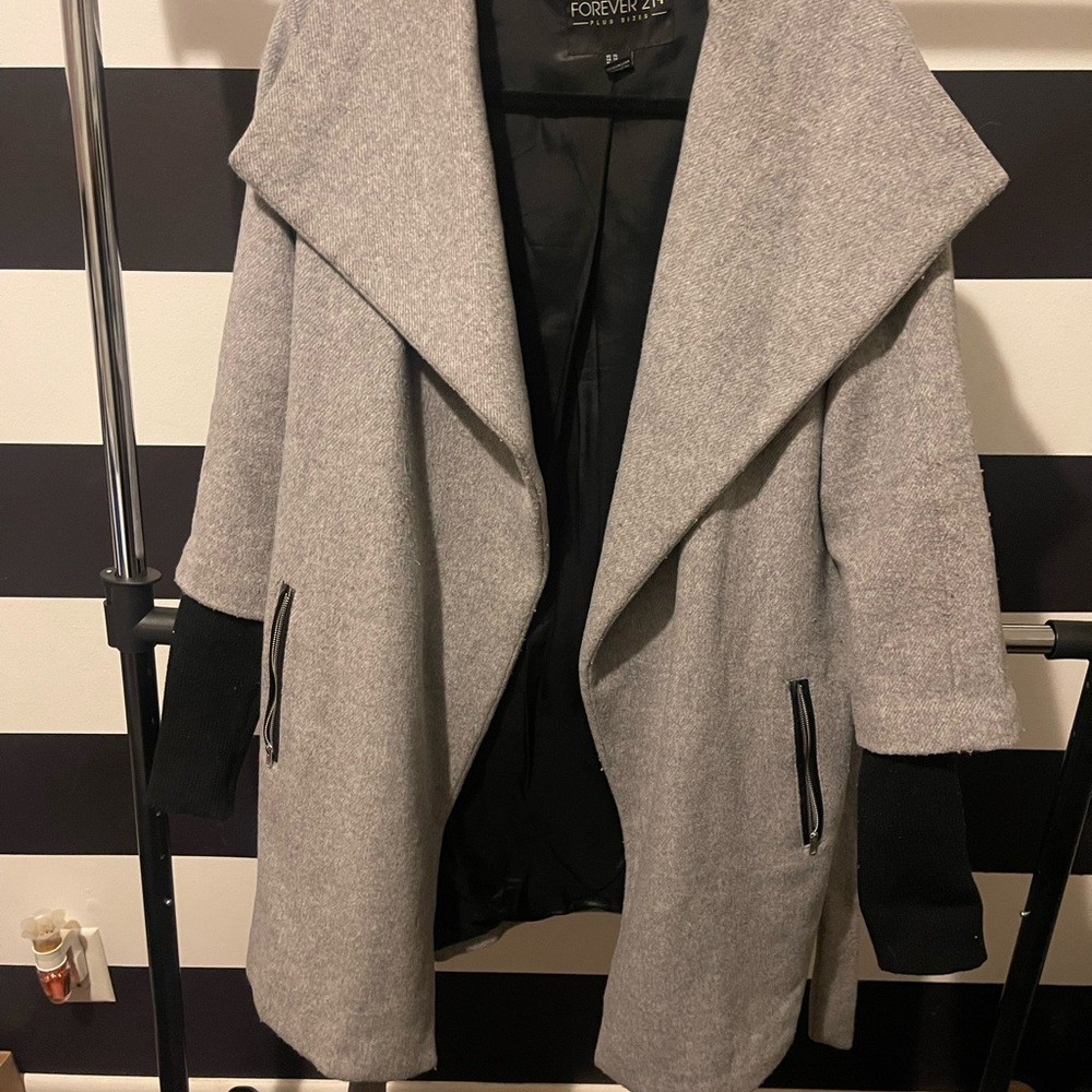 Peacoat with sweater sleeve accent.